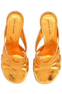 Golden metallic strappy mules by dries van noten featuring a high heel in orange leather details