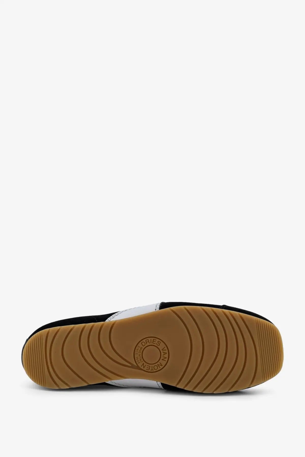 Dries Van Noten women’s black and white suede slip-on sneakers with tan rubber sole and circular tread patterns
