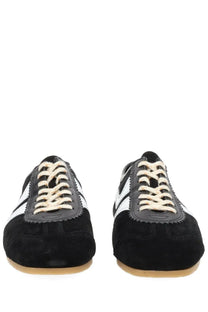 Dries Van Noten women’s suede sneakers in black with white stripes and cream-colored laces