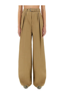 Tan high-waisted wide-leg trousers with matching belt and silver hardware from Dries Van Noten women’s collection