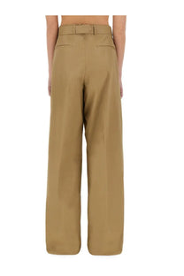 Dries Van Noten women’s tan wide-leg pants feature a structured high-waisted design with a matching belt