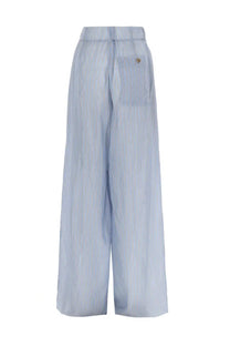 Back view of dries van noten women’s light blue and white striped high waist wide leg pants with small back pocket