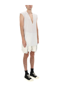 White sleeveless v-neck dress with layered asymmetrical hemline and raw-edge detailing by DRKSHDW men’s Bauhaus shorts white