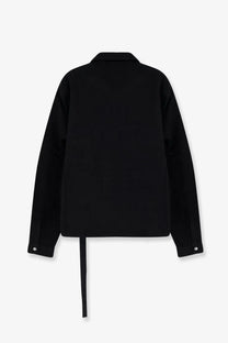 Back view of drkshdw men’s black denim jacket with oversized fit and subtle asymmetrical tie detail at back