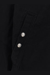 Drkshdw men’s black denim jacket with black fabric and two silver buttons on a flap pocket