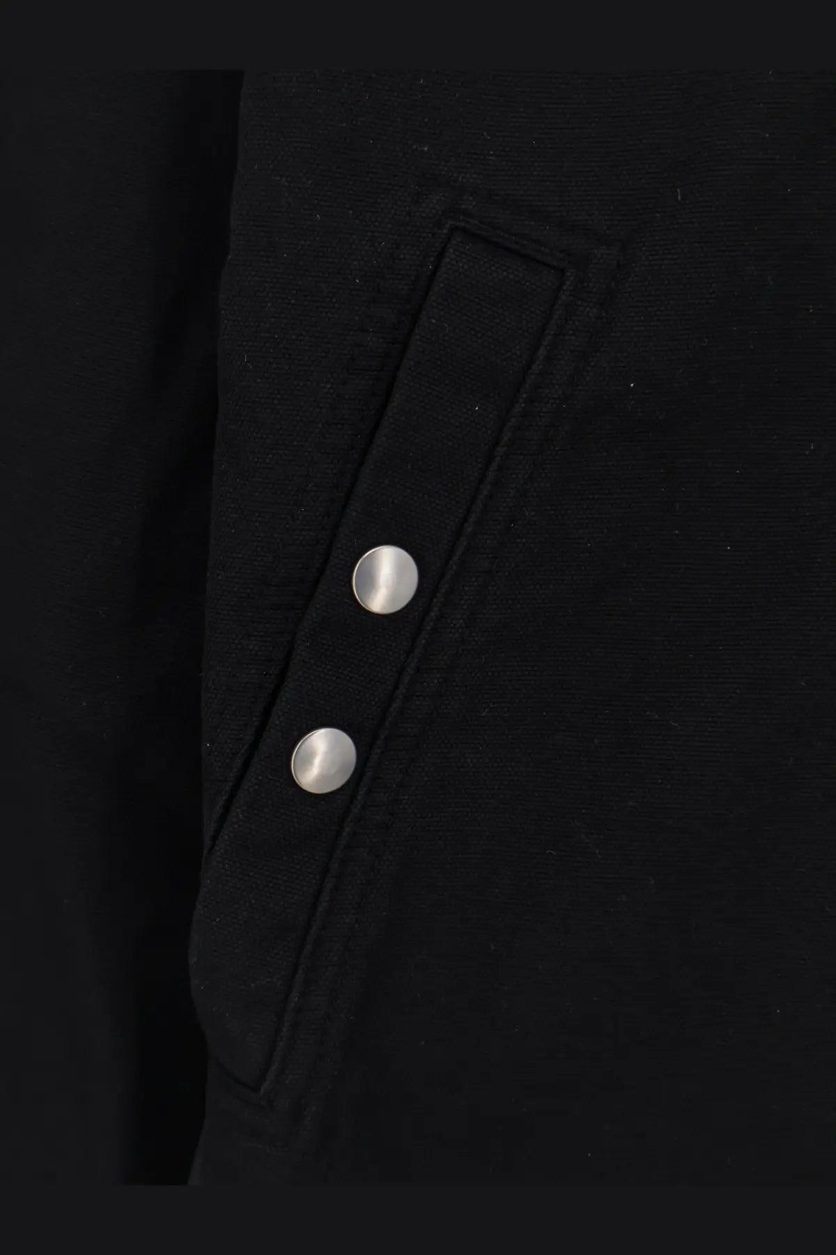 Drkshdw men’s black denim jacket featuring a black jacket flap pocket with two silver buttons
