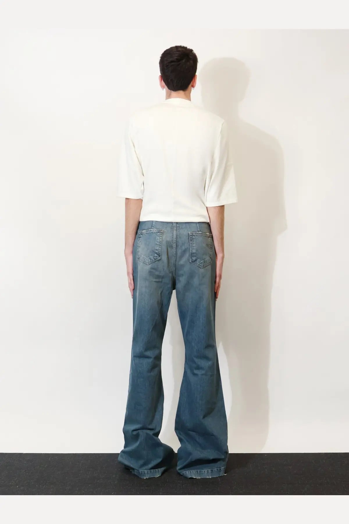 Blue denim flared jeans by drkshdw featuring classic five-pocket design and durable cotton material