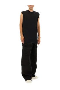 Black sleeveless t-shirt with relaxed oversized fit and ribbed neckline paired with drkshdw men’s cargo pants stefan black