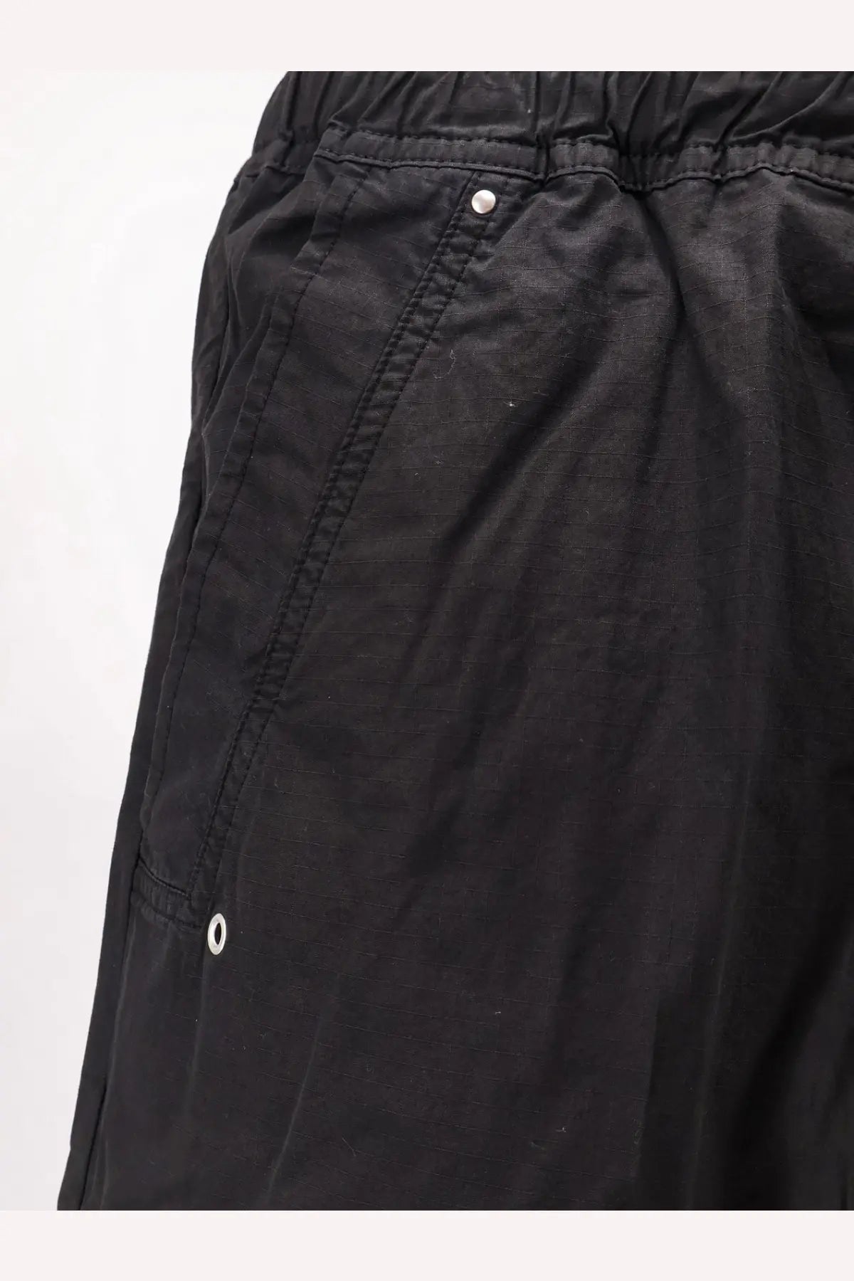 Drkshdw men’s black cotton trousers with elastic waistband and white button details
