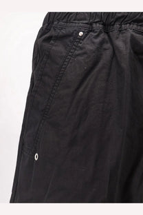 Drkshdw men’s black cotton trousers with elastic waistband and white button details
