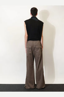 Back view of drkshdw men’s grey cotton trousers with brown wide-leg cargo pants style and two flap pockets