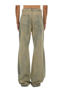 Wide-leg faded olive green denim jeans with relaxed fit and classic back pockets shown from the back side