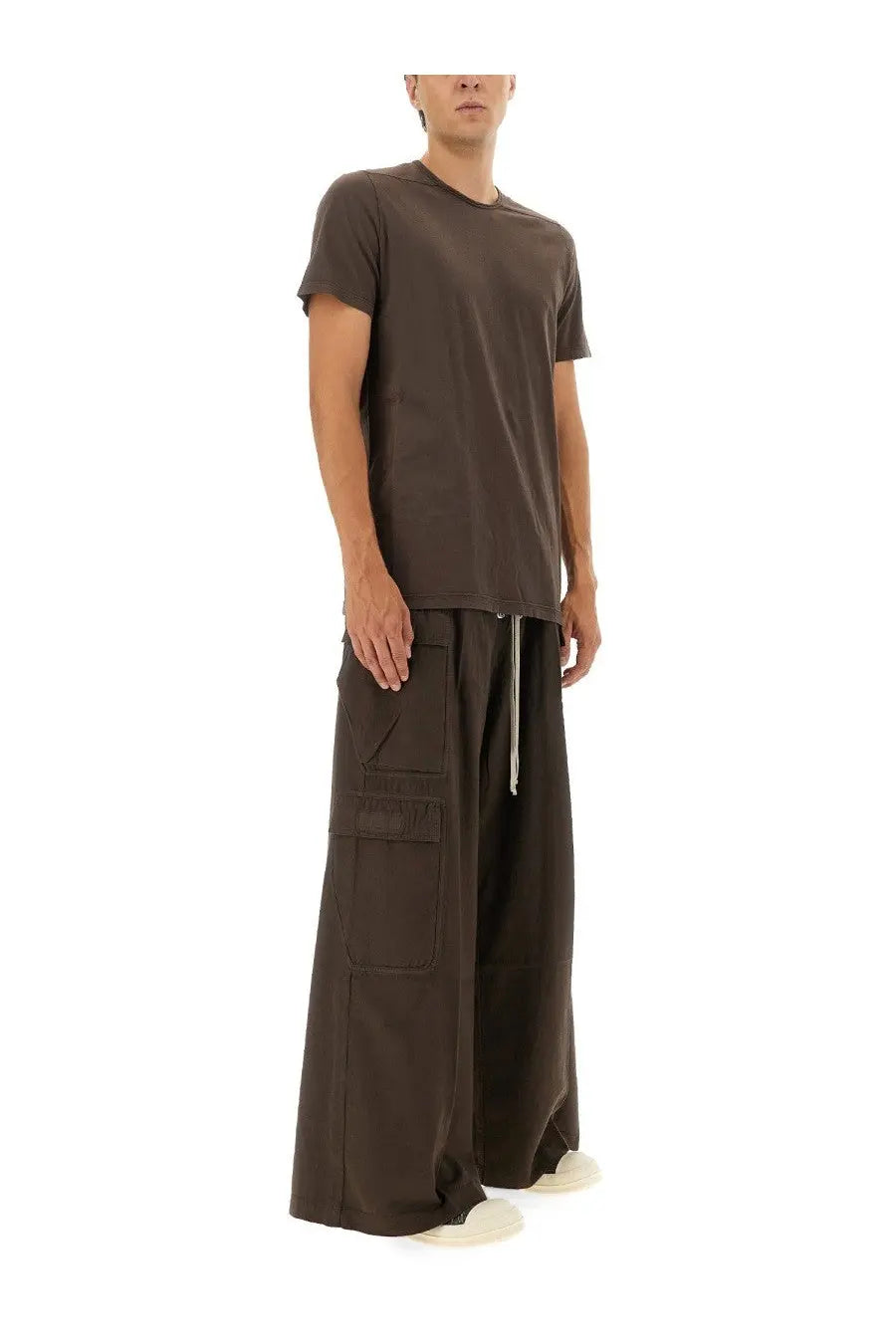 A minimalist dark brown short-sleeved t-shirt with a relaxed fit and subtle ribbed neckline paired with drkshdw men’s double cargo jumbo belas pants brown