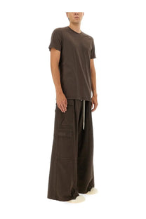 A minimalist dark brown short-sleeved t-shirt with a relaxed fit and subtle ribbed neckline paired with drkshdw men’s double cargo jumbo belas pants brown