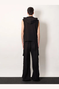 Black sleeveless hoodie with attached hood and relaxed fit paired with drkshdw men’s double cargo jumbo belas trousers black