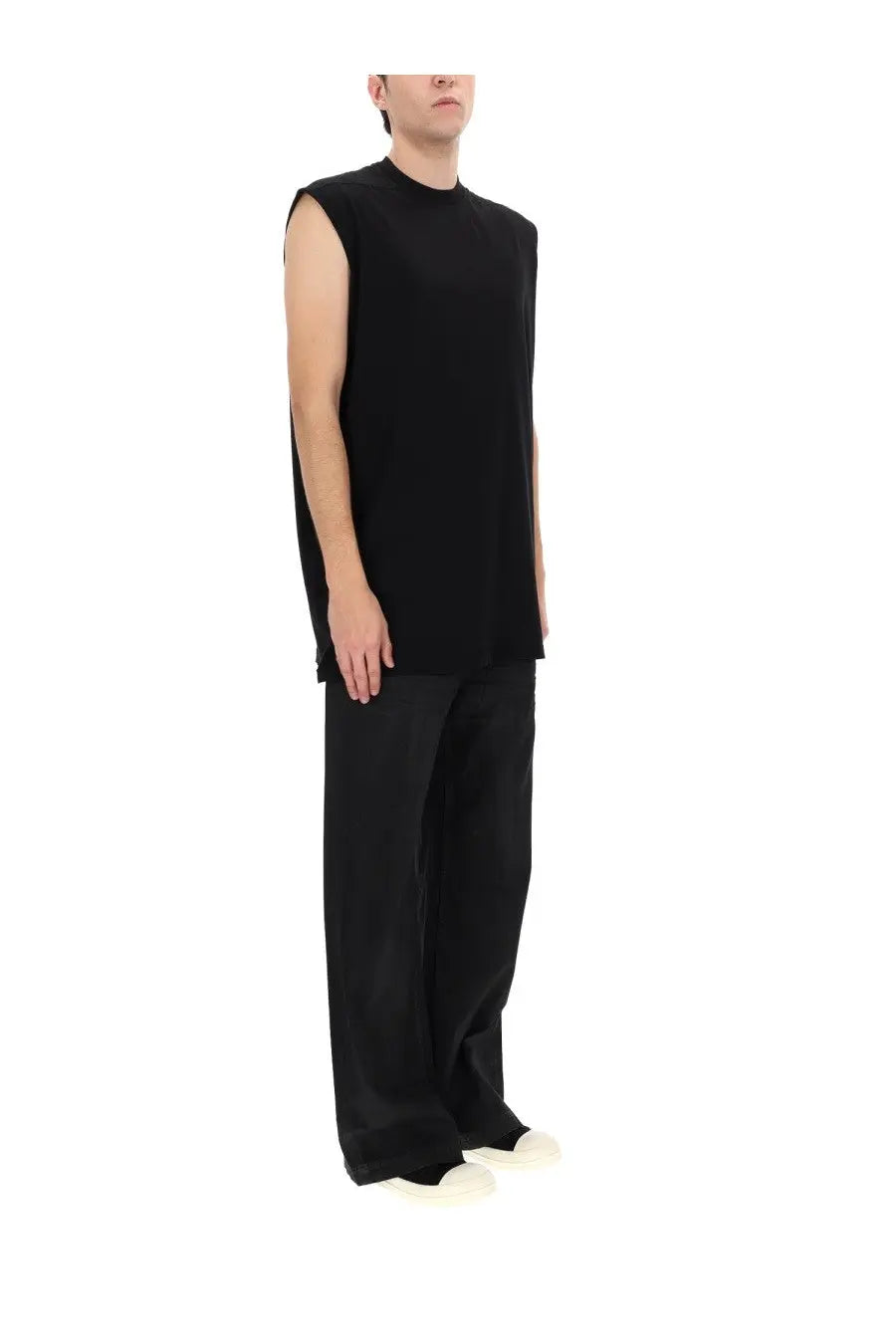 Black sleeveless knit top with high neckline and relaxed fit shown with drkshdw men’s jeans geth black