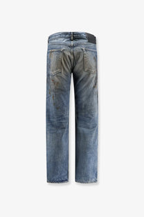 Back side of drkshdw men’s washed blue denim jeans with faded distressing and subtle brown stains on pockets