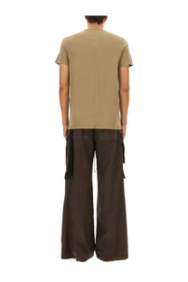Beige short-sleeved drkshdw men’s level shirt showing back side with subtle vertical seam down center