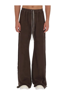 Brown wide-leg cotton sweatpants with drawstring waist and white cord accents from drkshdw men’s pants pusher collection