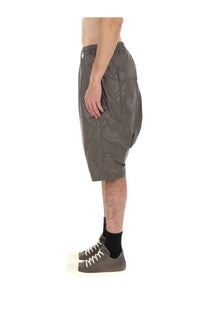 Olive green drkshdw men’s lightweight nylon shorts with relaxed fit and elastic waistband front view