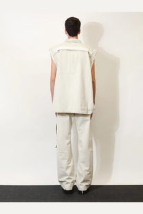 Cream-colored sleeveless denim vest with structured collar and frayed edges from DRKSHDW men’s white jacket collection
