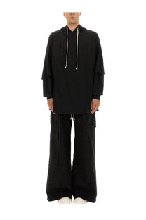 Black oversized hoodie with white drawstrings and layered sleeves from drkshdw men’s tommy hustler collection
