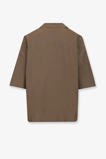 Brown minimalist blazer with structured collar and three quarter sleeves made from smooth lightweight fabric