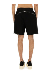 Back view of drkshdw men’s black boxer shorts with silver zipper detail on waistband and frayed hem