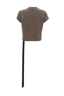 Back view of drkshdw women’s taupe cropped short-sleeved shirt with black ribbon detail at back hem