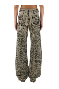 Drkshdw women’s wide-leg denim pants in black with distressed cracked pattern in muted olive and beige tones