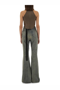Back view of olive green flared denim pants with black vertical strap from drkshdw women’s tank top beige collection