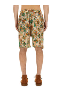 Beige shorts by drôle de monsieur featuring a vibrant green and orange playing card pattern multicolor bermuda shorts