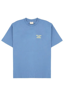 Drôle de monsieur men’s light blue cotton t-shirt with small yellow embroidered phrase on left chest