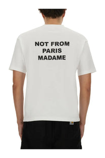 Back of drôle de monsieur men’s white cotton t-shirt with bold black not from paris madame text printed across the back