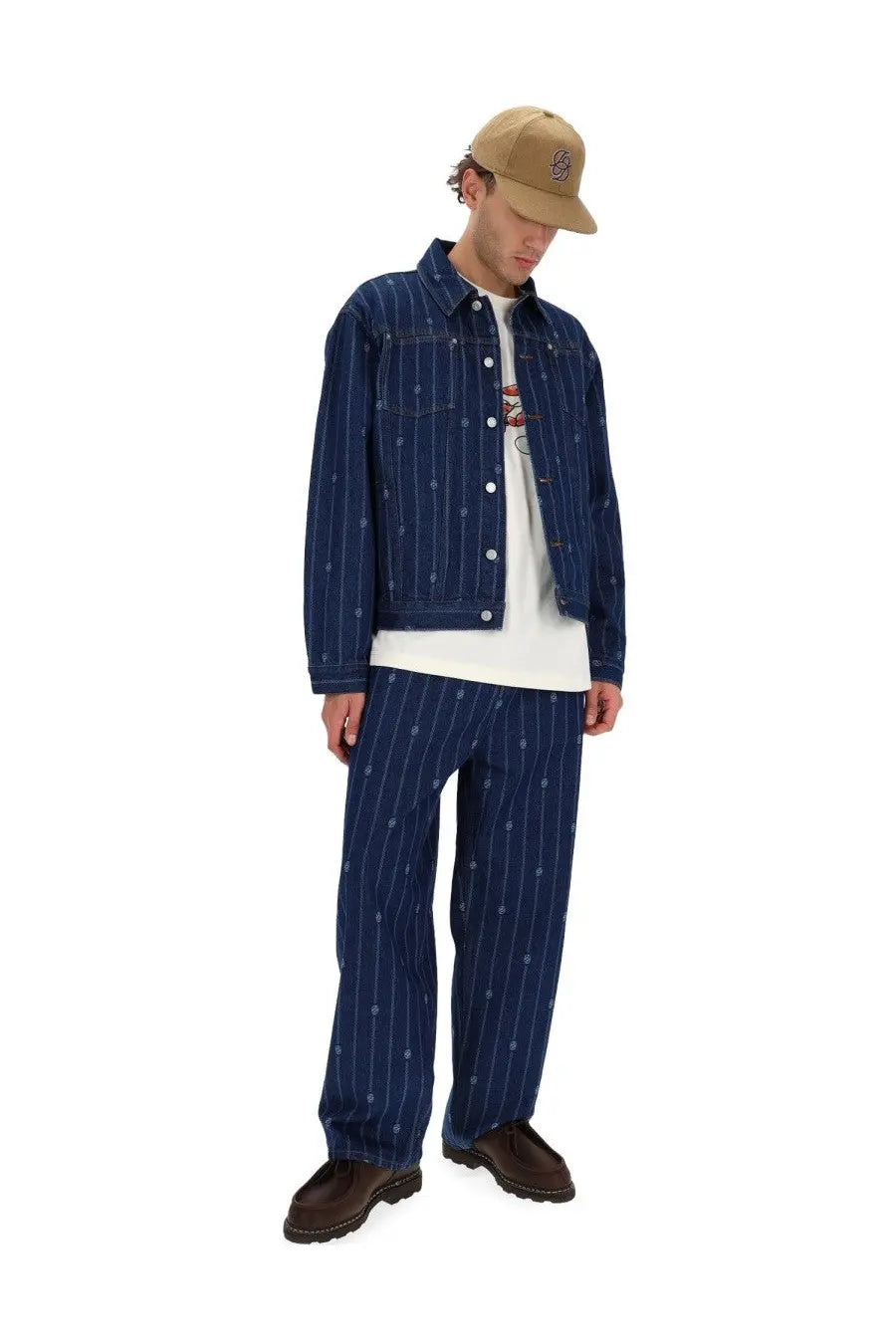 Navy blue pinstripe denim jacket with white vertical stripes and small embroidered details from Drôle de Monsieur men’s collection