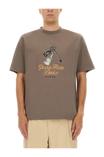 Drôle de Monsieur men’s taupe short-sleeved t-shirt with key and bottle graphic and grand hotel drôle gold text print