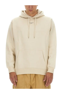 Drôle de Monsieur men’s beige cotton hoodie with cream color black logo on chest and matching drawstrings