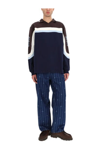 Drôle de Monsieur men’s long-sleeved polo shirt in racing blue with white stripes and subtle sleeve patterns