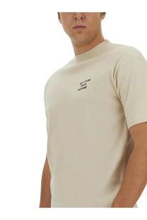 Drôle de Monsieur men’s beige short-sleeved t-shirt with subtle black embroidered slogan on chest