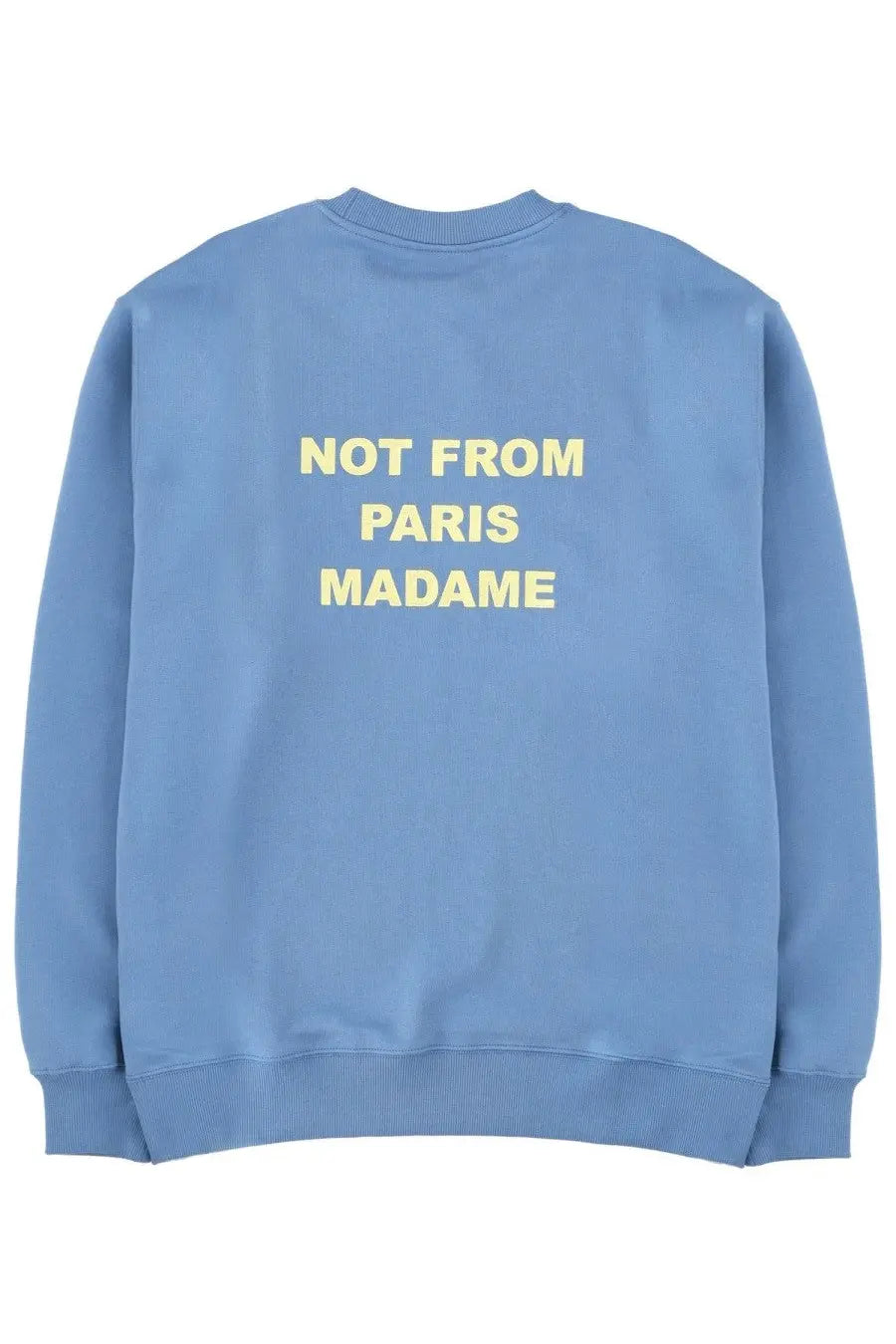 Back of a light blue drôle de monsieur men’s sweatshirt with yellow not from paris madame text across the back