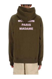 Olive green Drôle de Monsieur men’s cotton hoodie with pink embroidered slogan on the back for casual wear