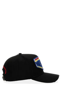 Black dsquared2 men’s baseball hat featuring a colorful embroidered wrestle patch in blue red and yellow trim