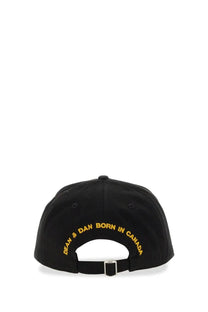 Black dsquared2 men’s baseball hat with gold embroidered dean and dan born in canada text on the back