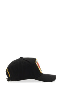 Dsquared2 men’s black baseball hat with red and yellow embroidered patch and gold lettering on the side