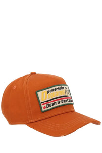 Dsquared2 men’s orange baseball hat with rectangular patch featuring bold yellow black and red lettering