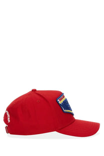 Dsquared2 men’s red baseball hat with blue and yellow embroidered patch on the front in cotton material