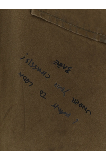 A close-up of a khaki cotton fabric pocket with handwritten text on the Dsquared2 men’s bros padded jacket beige