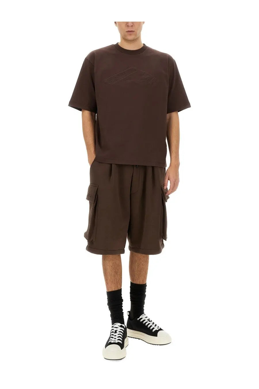 Brown dsquared2 men’s oversized t-shirt with a subtle embossed logo on the chest paired with cargo bermuda shorts