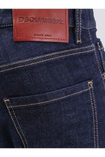 Dark blue denim jeans with a brown leather dsquared2 patch since 1984 on the back for men cool guy style