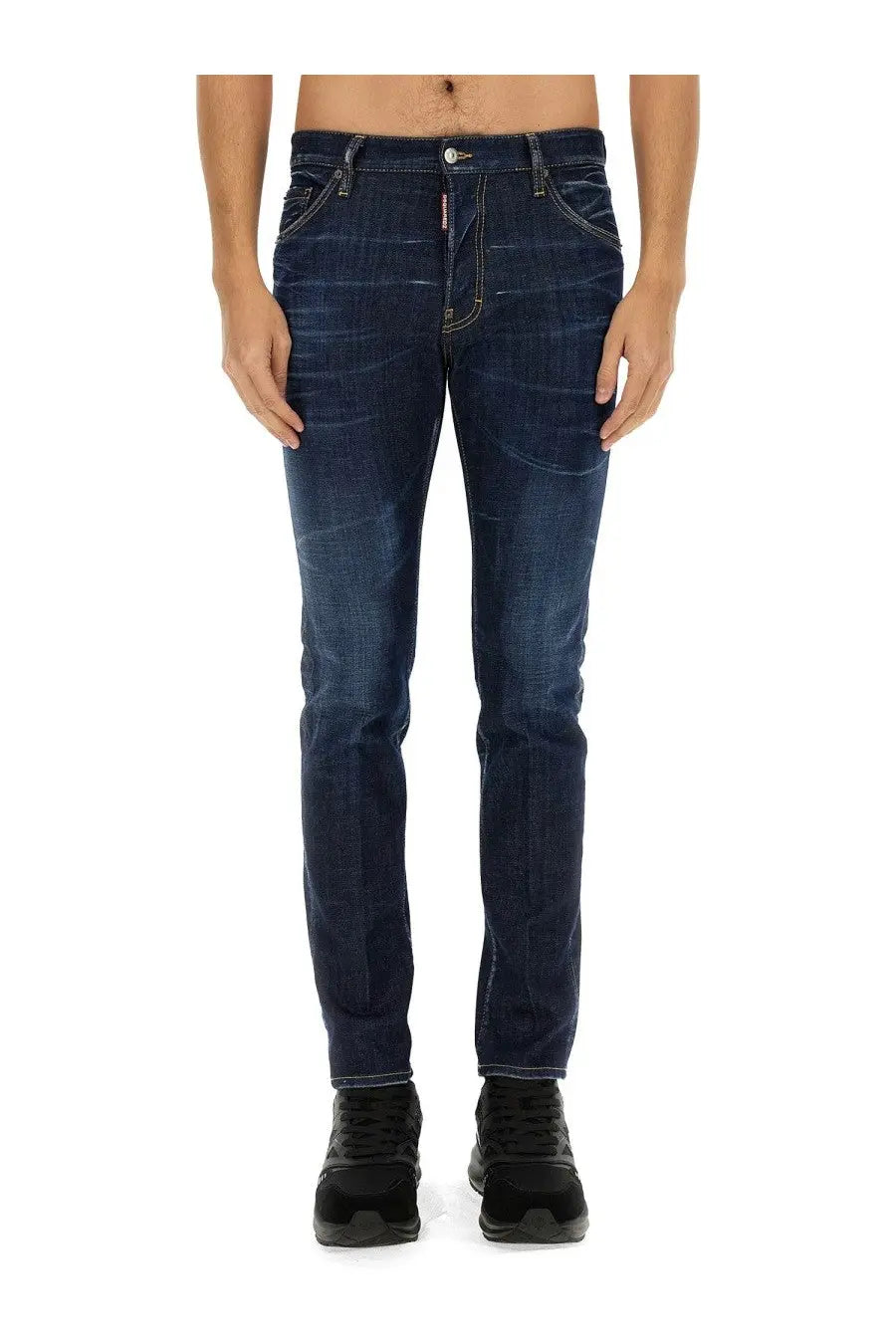 Back side of dark blue slim fit denim jeans with subtle fading and dsquared2 logo on the waistband